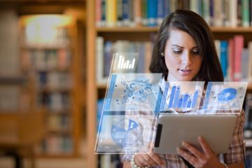 Woman on iPad with graphs