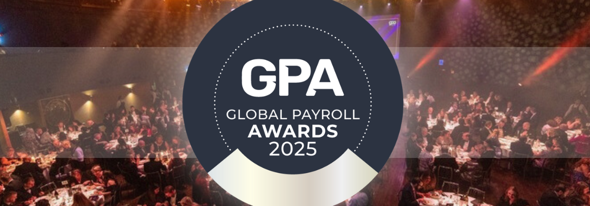 Guests dining at the 2025 Global Payroll Awards, with stage lights and GPA logo displayed prominently